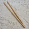 pincet bamboe in zand Pincet Bamboe